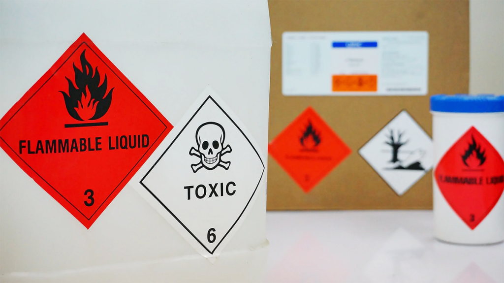Chemical waste labels and stickers displayed on packaging