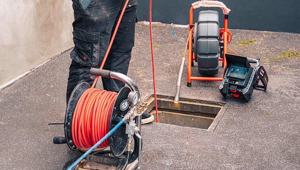 A person undertaking a CCTV inspection