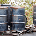 Aged metal barrels outside