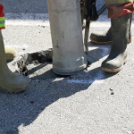 Vacuum excavation equipment safely exposing underground services on a civil construction site.