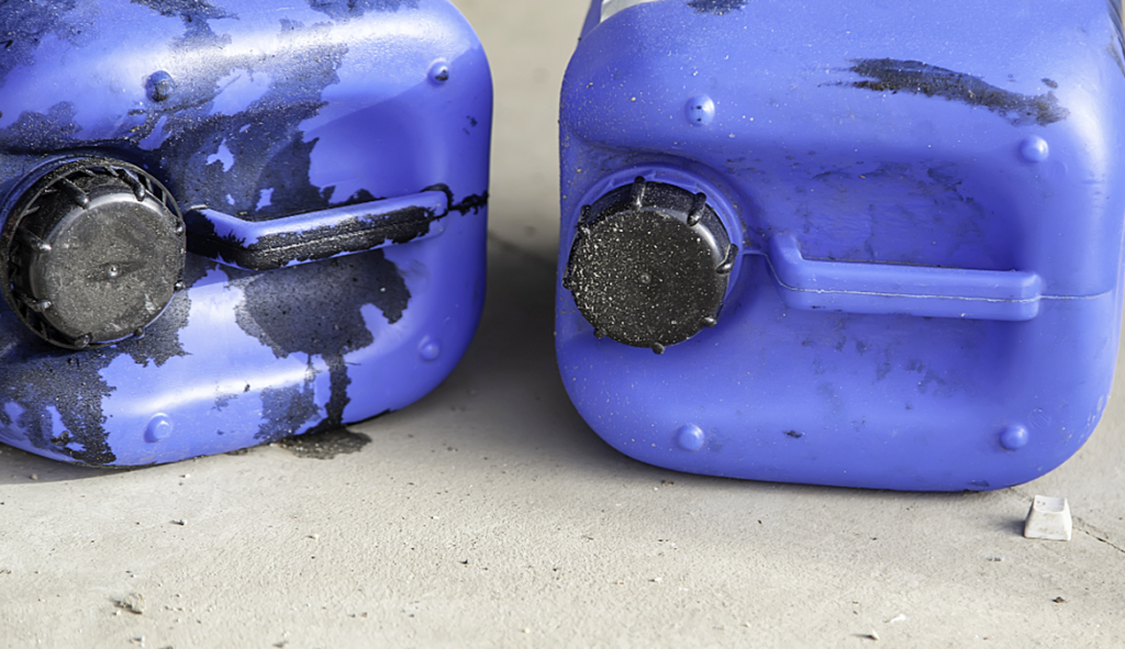 Blue containers used for storing waste oil