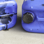 Blue containers used for storing waste oil
