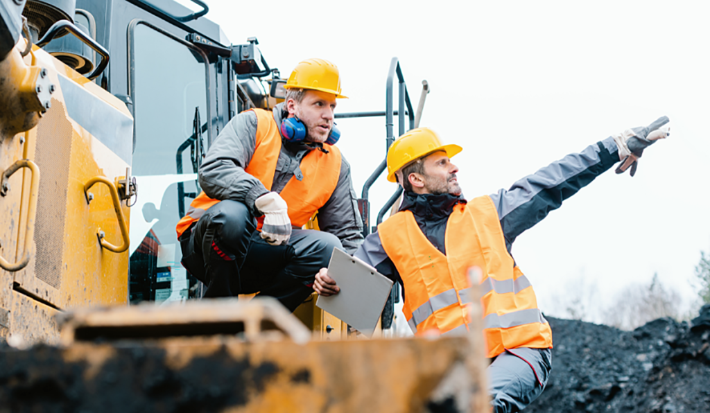 Workers conducting excavation work near underground services