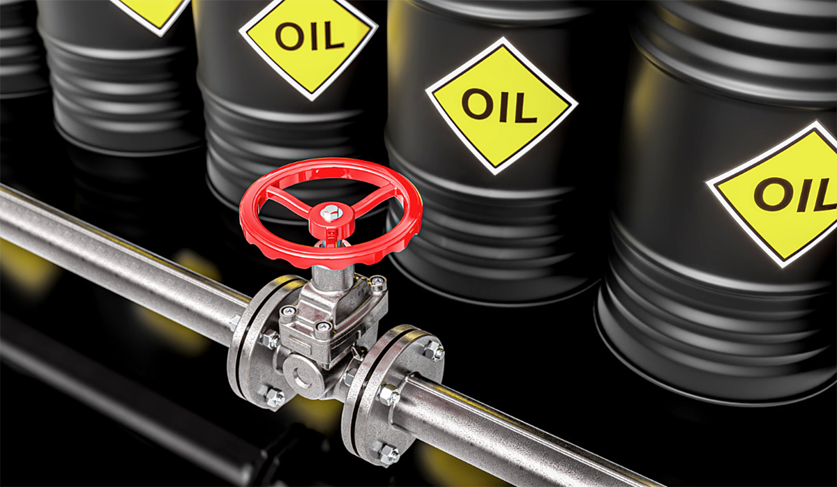 Industrial oil storage drums labelled “OIL” alongside a metal pipeline with a red control valve, representing industrial oily water management and waste disposal.